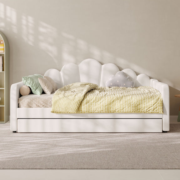 White upholstered daybed frame with arched shell back and slatted mattress support