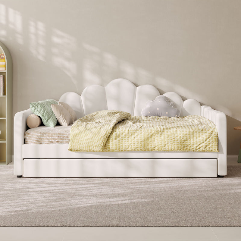 White upholstered daybed frame with arched shell back and slatted mattress support