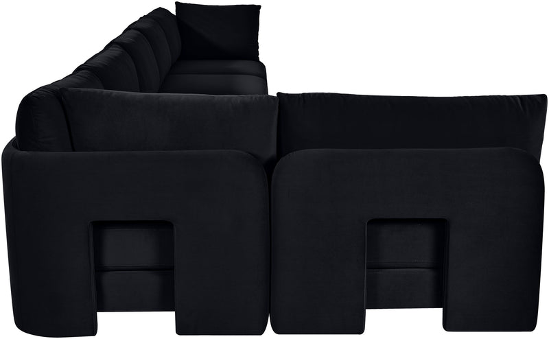 Black velvet armless sectional sofa with square back cushions and ottoman seats