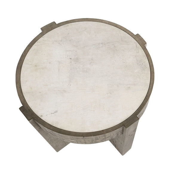 Round tabletop with distressed gray base supports and concrete-look top surface.