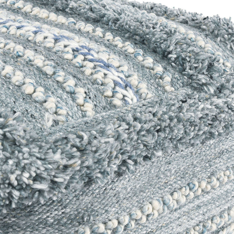 Blue and cream textured boucle-style pouf upholstery with looped fabric