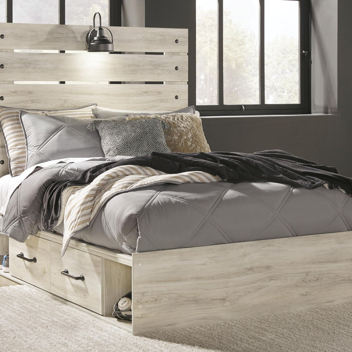 Cambeck panel bed with light wood headboard panels and two front drawer compartments