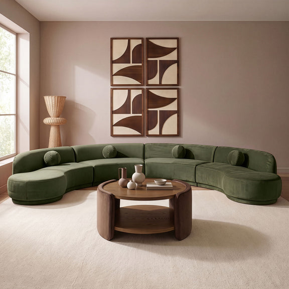 Green velvet sectional sofa with rounded chaise and plush cushions