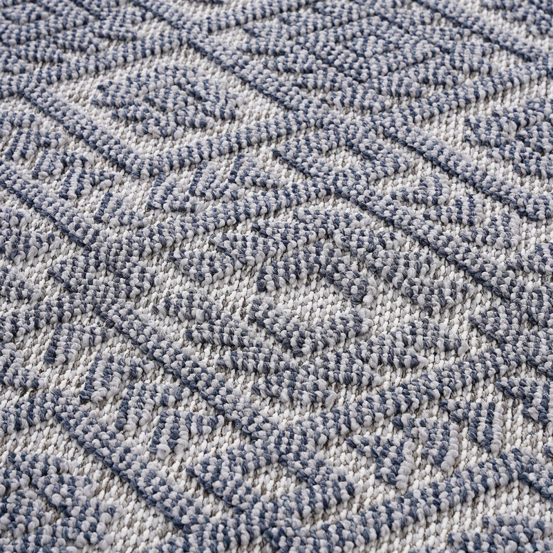Gray and white geometric pattern woven area rug with textured surface