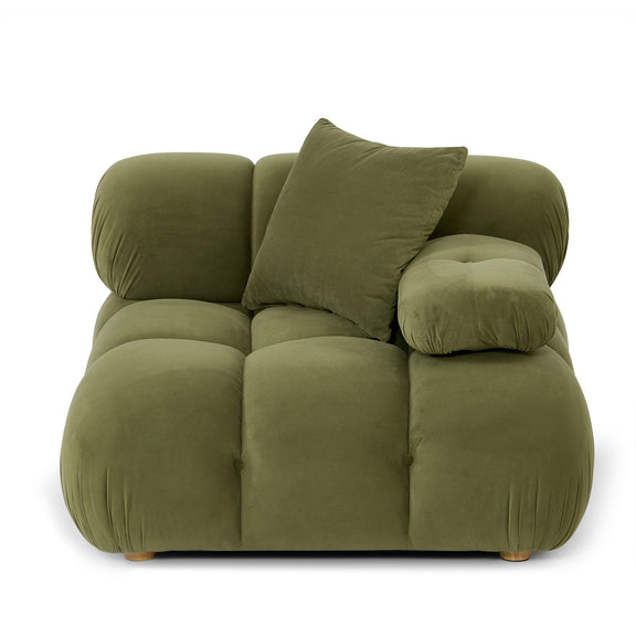 Green modular corner chair with layered cushions and two decorative pillows.