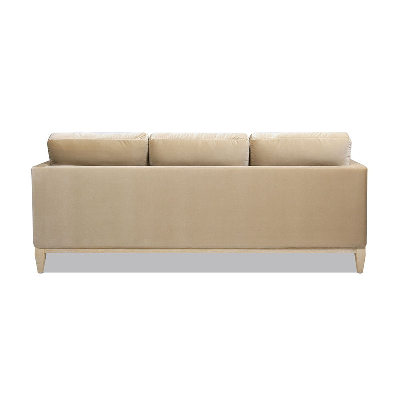 Modern farmhouse sofa in tan/beige upholstery with three seat-back cushions.