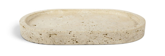 Beige round travertine tray with speckled top surface