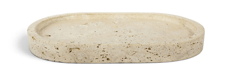 Beige round travertine tray with speckled top surface