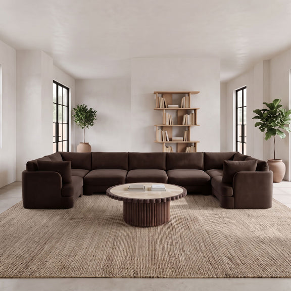 Dark brown U-shaped sectional sofa with thick armrests and cushioned seats