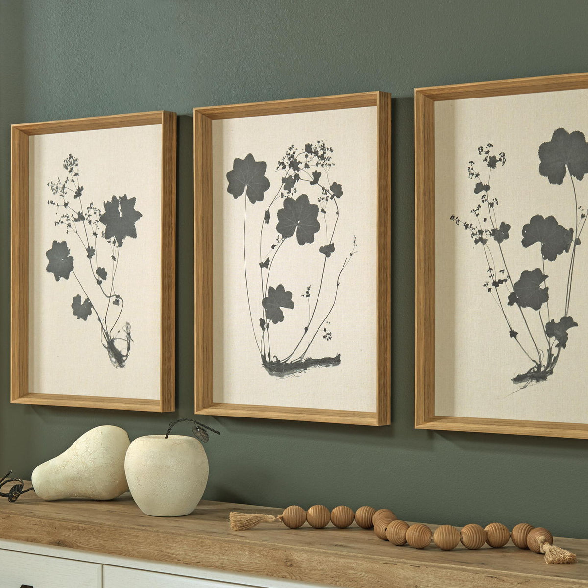 Set of 3 framed linen botanical prints with black flower and leaf silhouettes