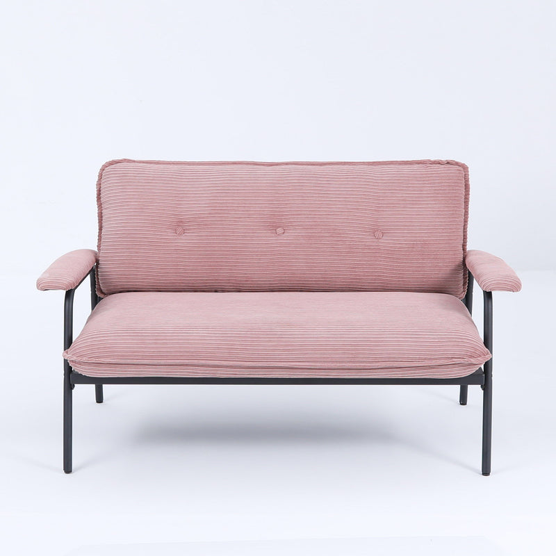 Pink metal frame sofa with striped upholstery and tufted back cushions