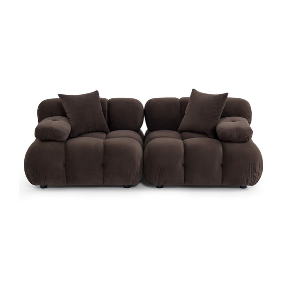 Dark brown modular loveseat with padded back cushions, tufted seats, and two throw pillows
