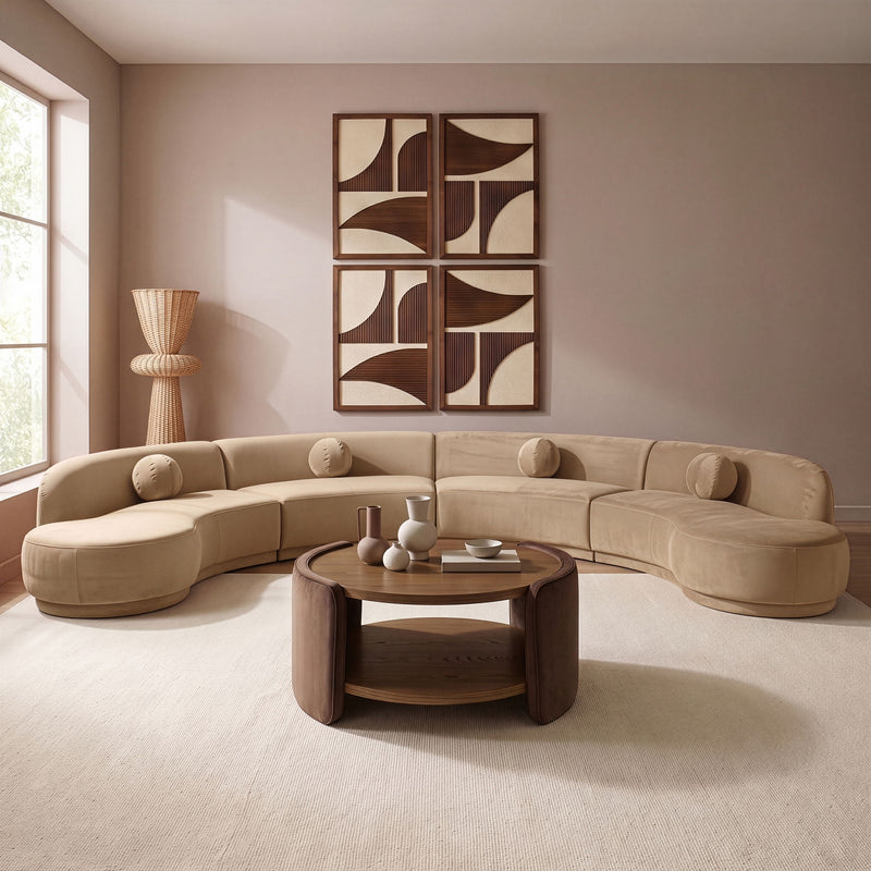 Beige velvet sectional sofa with rounded chaise and plush cushions