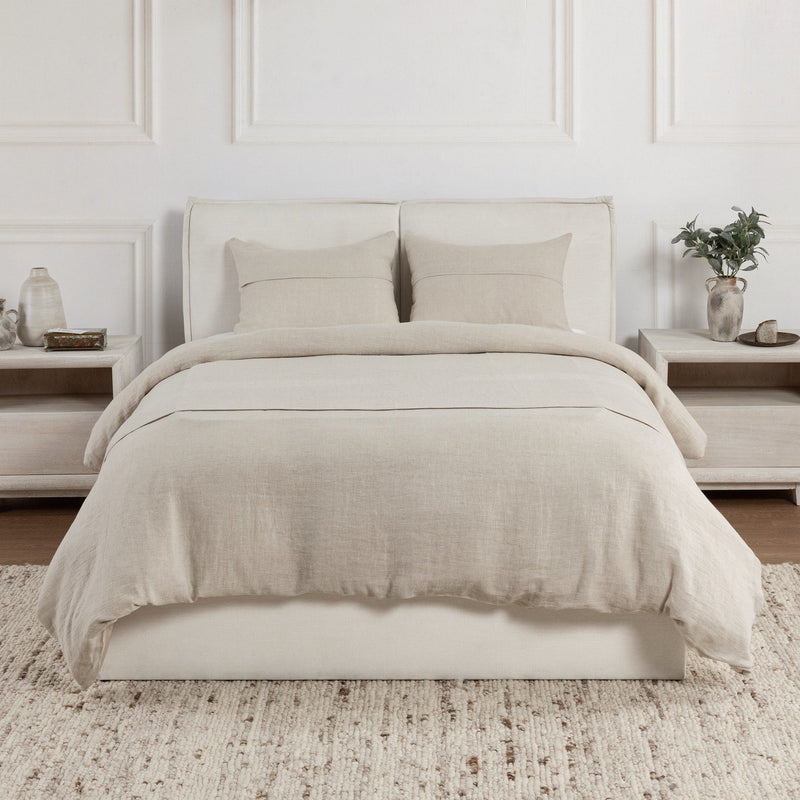 Beige linen sham pillows on a bed with coordinated bedding and pillows