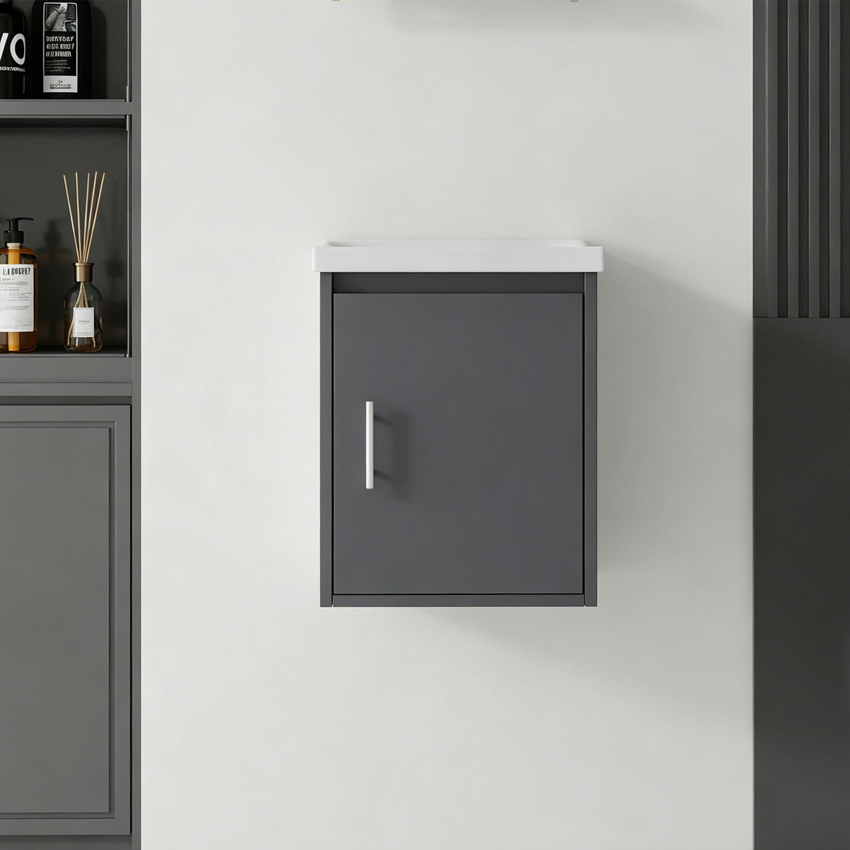 Wall-mounted bathroom vanity cabinet in dark gray with single door and long handle