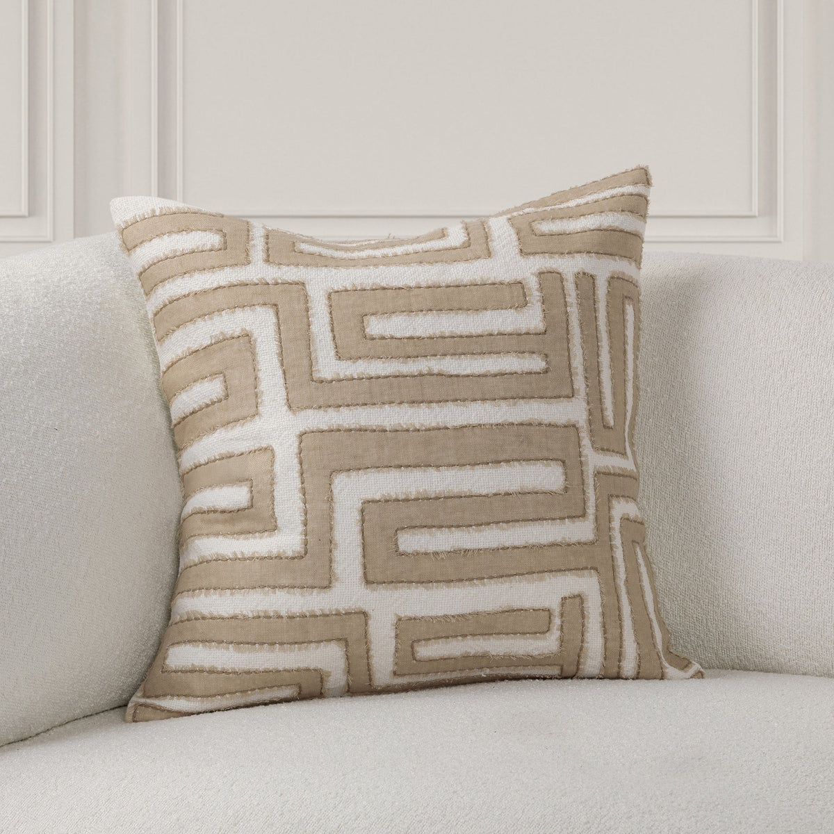 Mateo pillow with tan geometric maze embroidery on light natural fabric