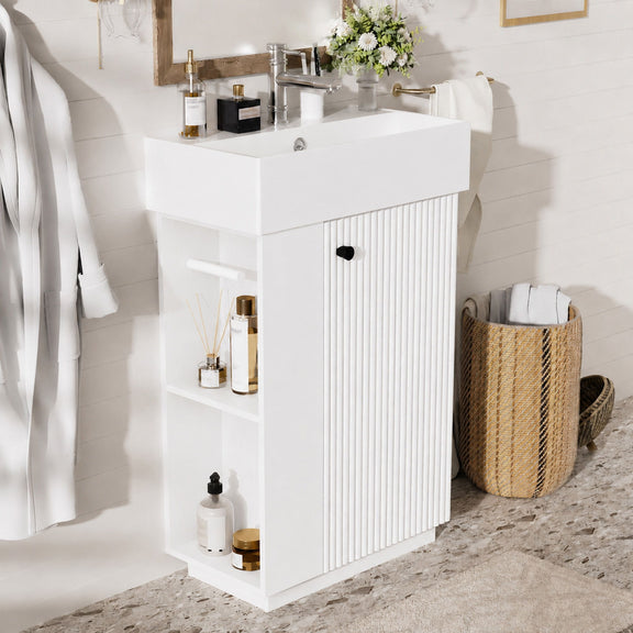 White freestanding bathroom vanity with sink top, open side shelves, and ribbed door