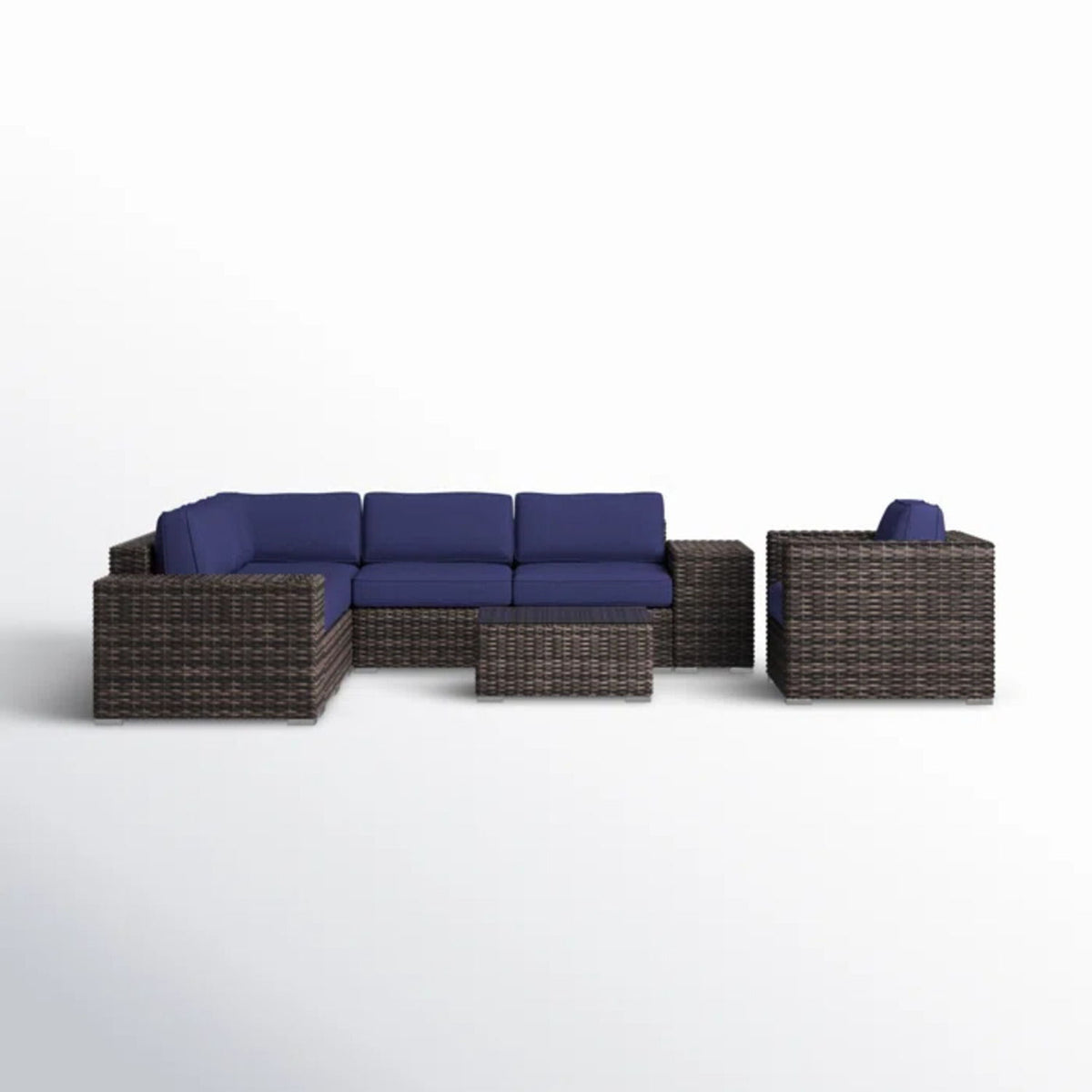 Dark brown wicker sofa seating set with blue cushions and rectangular ottoman table