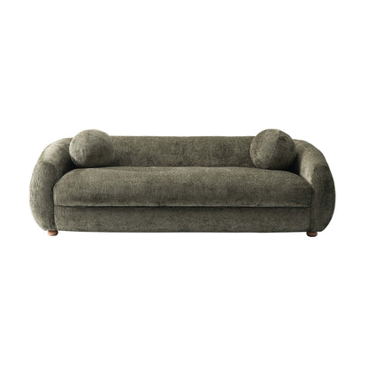 Green upholstered sofa with rounded arms and two round accent pillows