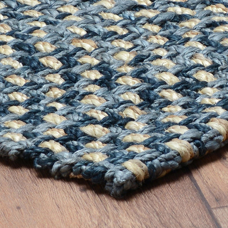 Braided indigo and cream area rug with flat weave and short fringe edge