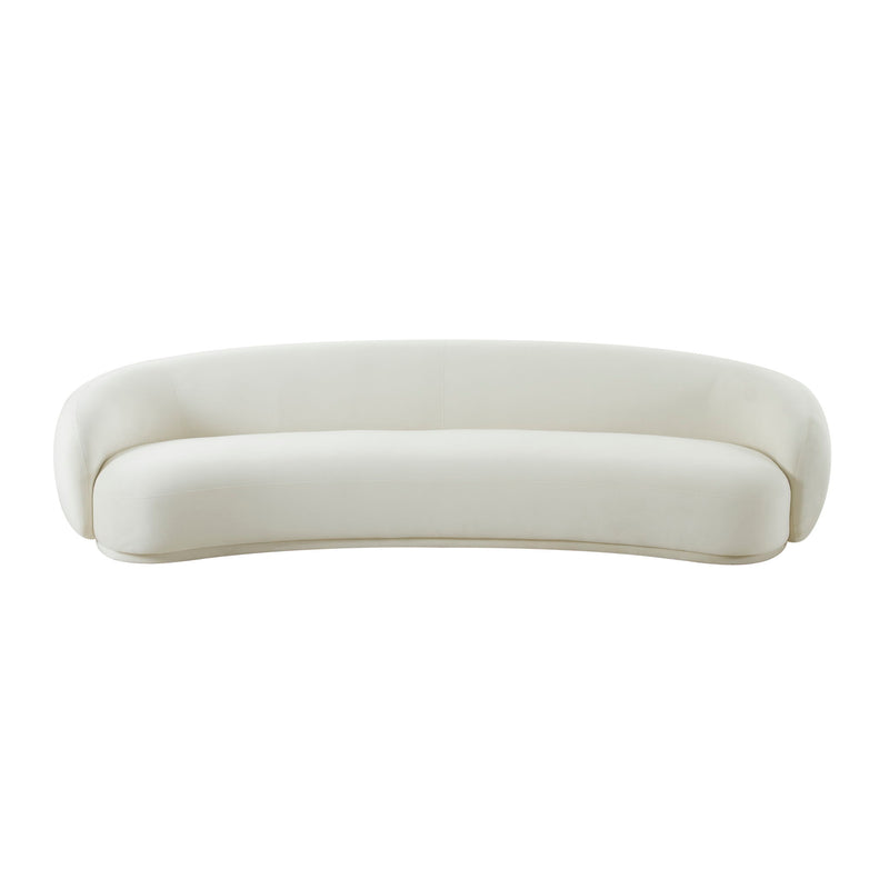 Beige velvet sofa with rounded arms and back, low curved silhouette
