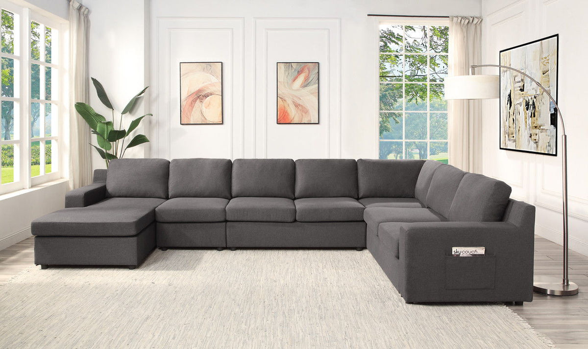 Dark gray U-shaped sectional sofa with chaise, boxy armrests, and stitched seat cushions
