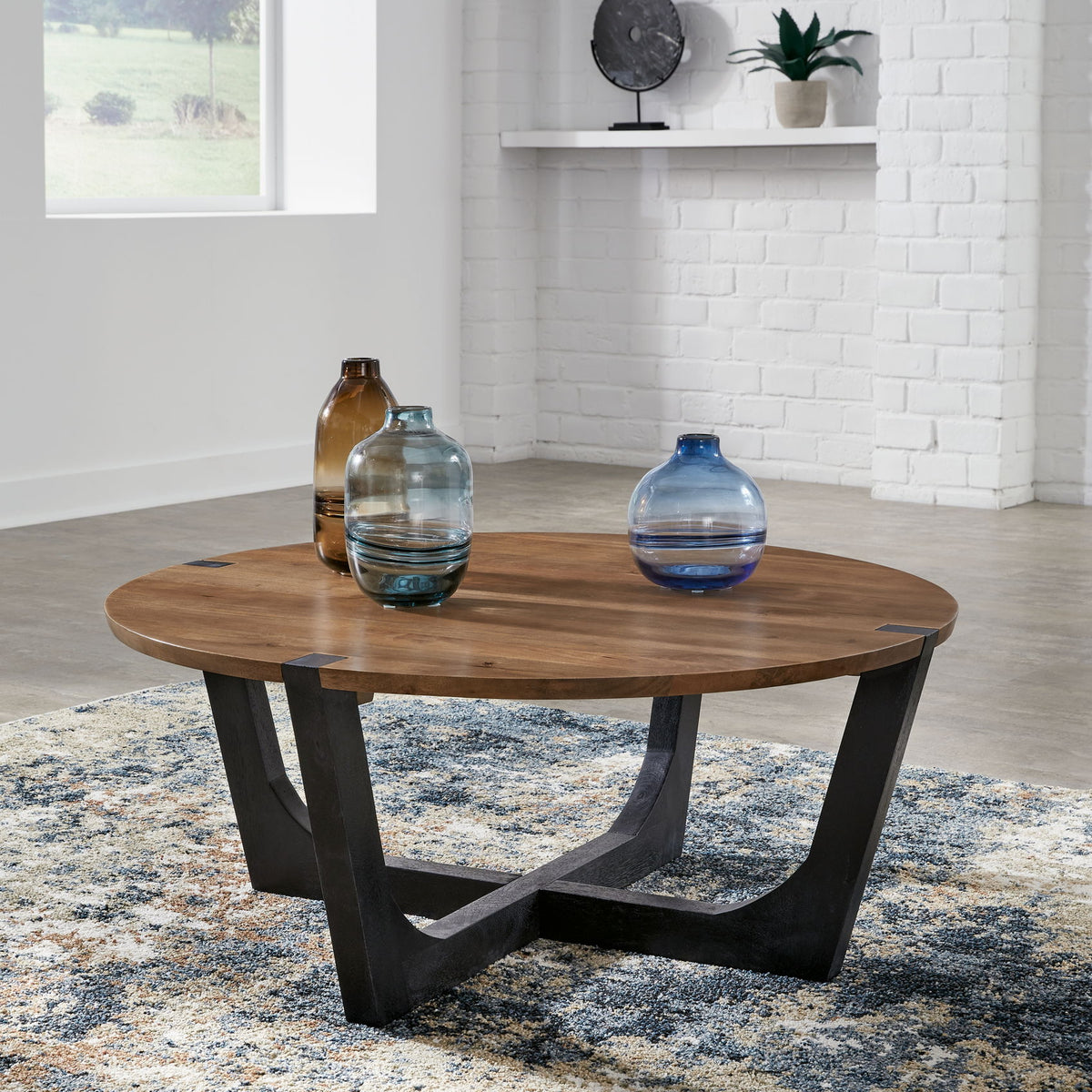 Hanneforth - Round Cocktail Table - Brown
