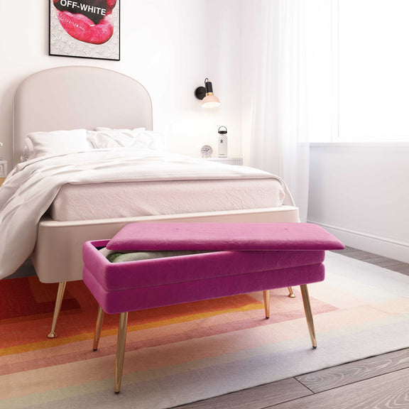 Purple velvet storage bench with padded top and slender gold legs, closed lid