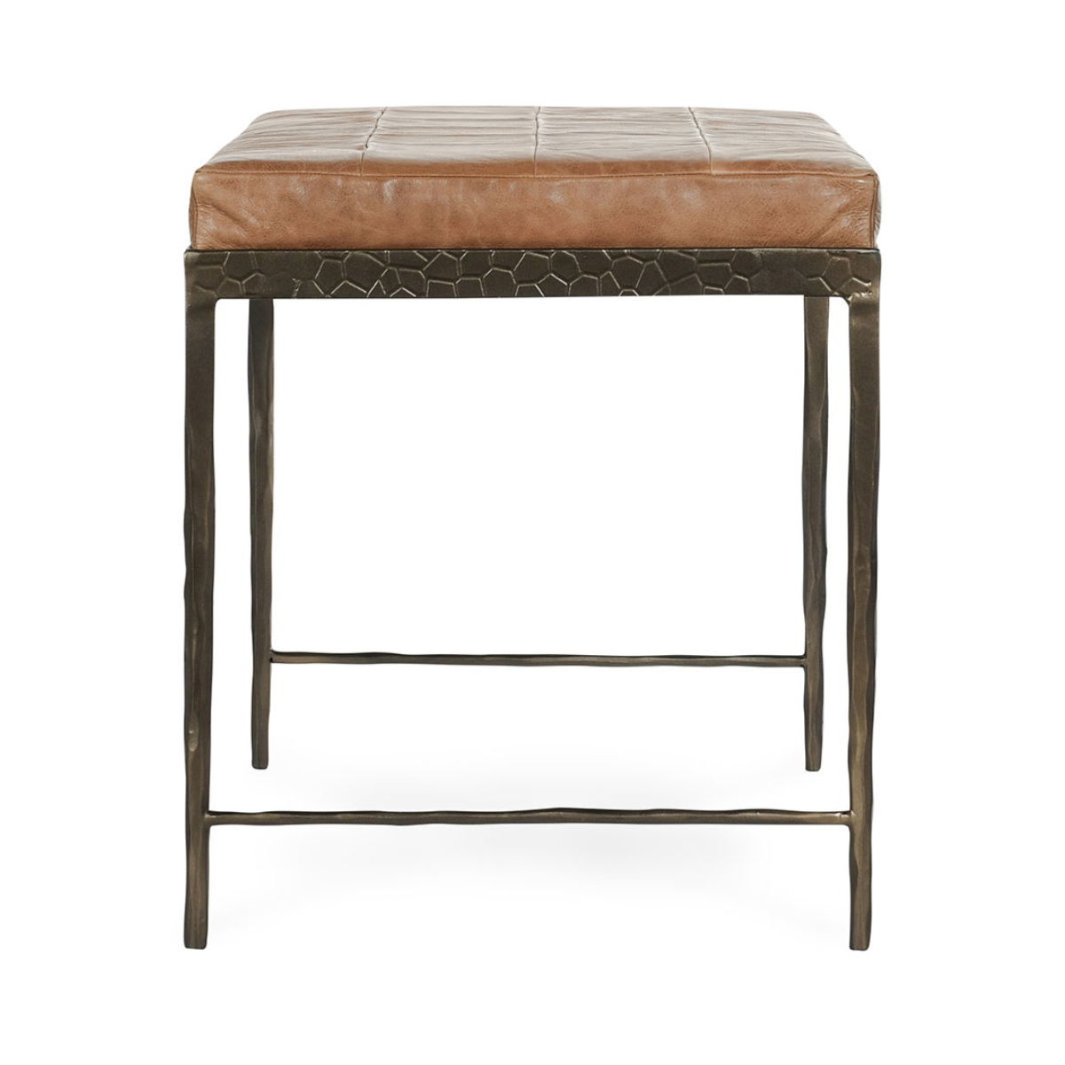 Brown leather bench with textured front skirt, padded seat, and dark legs