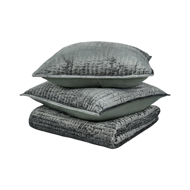 Stacked gray velvet pillow covers