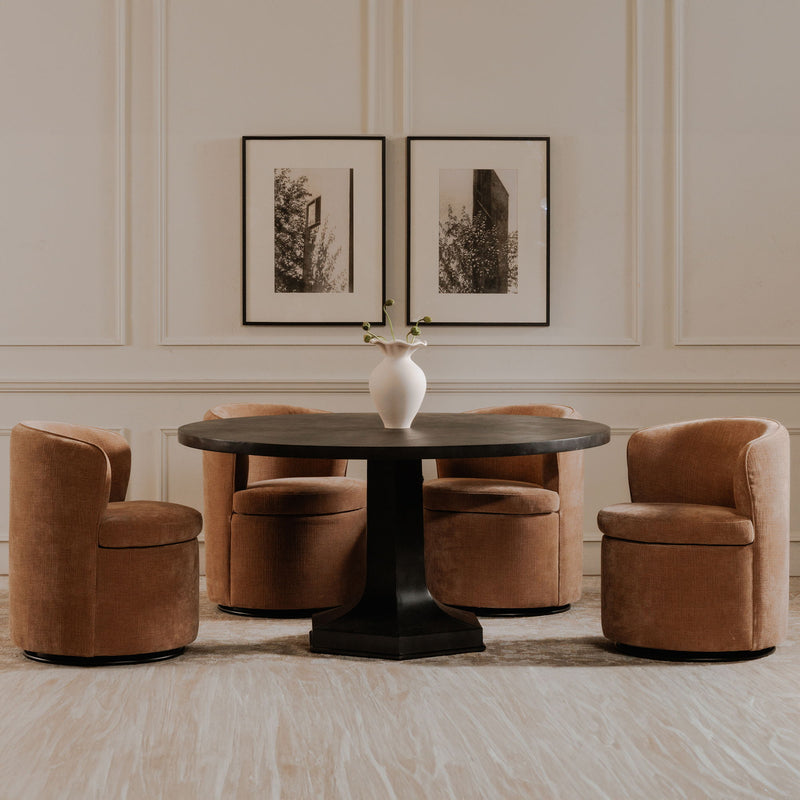 Dusty pink upholstered swivel accent chairs with rounded arms and cushioned seats