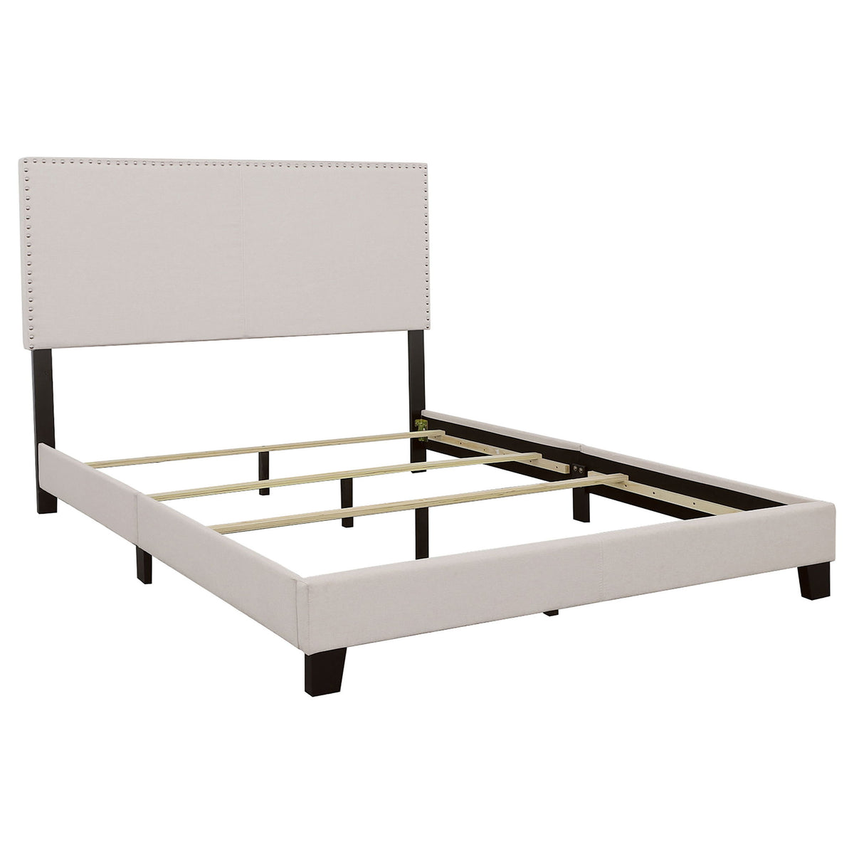 Ivory upholstered platform bed with nailhead-trim headboard and slatted base