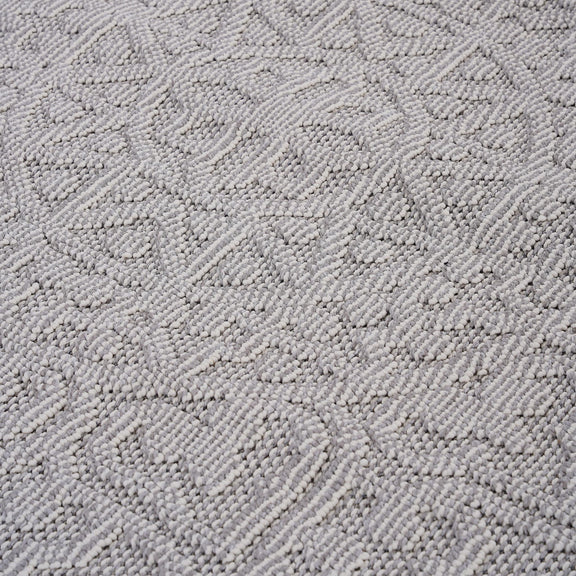 Medallion indoor/outdoor area rug in light gray with raised loop-texture geometric design