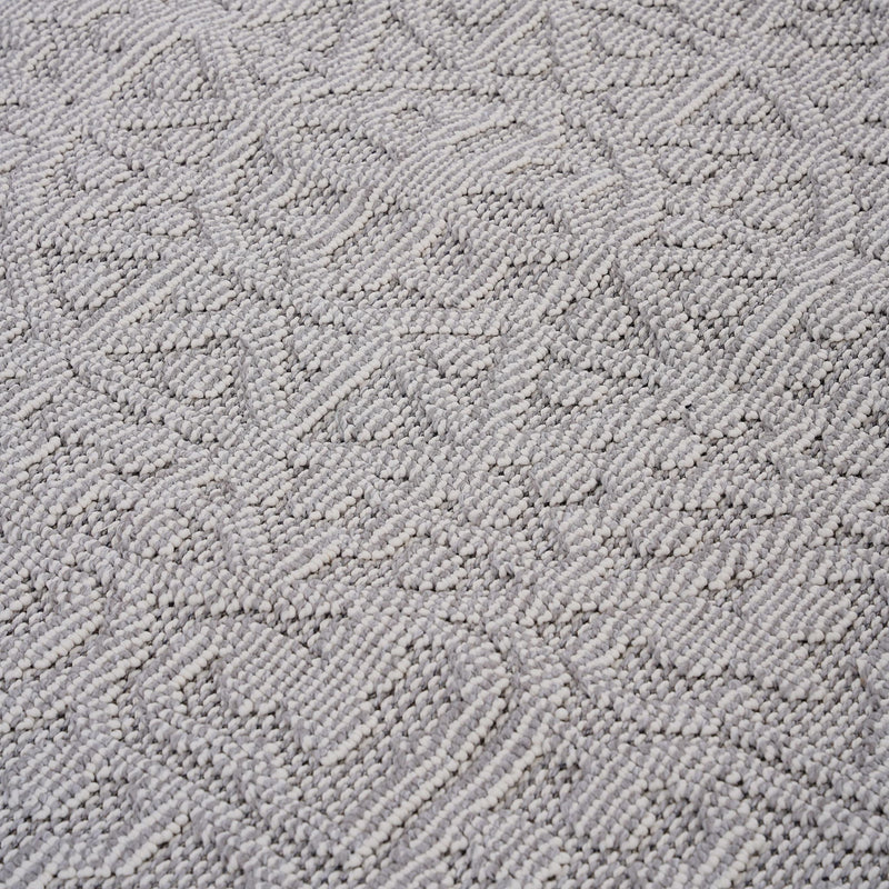 Medallion indoor/outdoor area rug in light gray with raised loop-texture geometric design