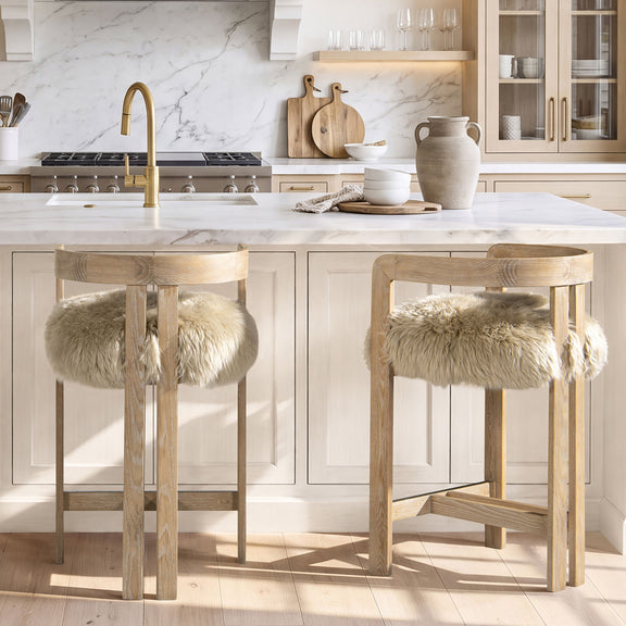 Light brown low-back counter stool with upholstered seat and faux fur back