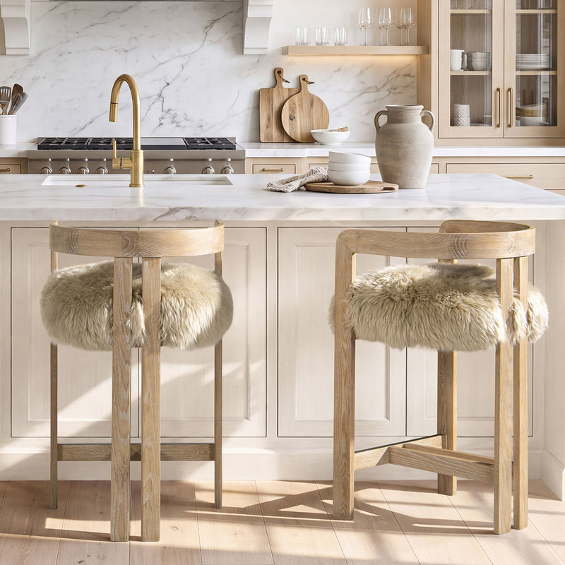 Light brown low-back counter stool with upholstered seat and faux fur back