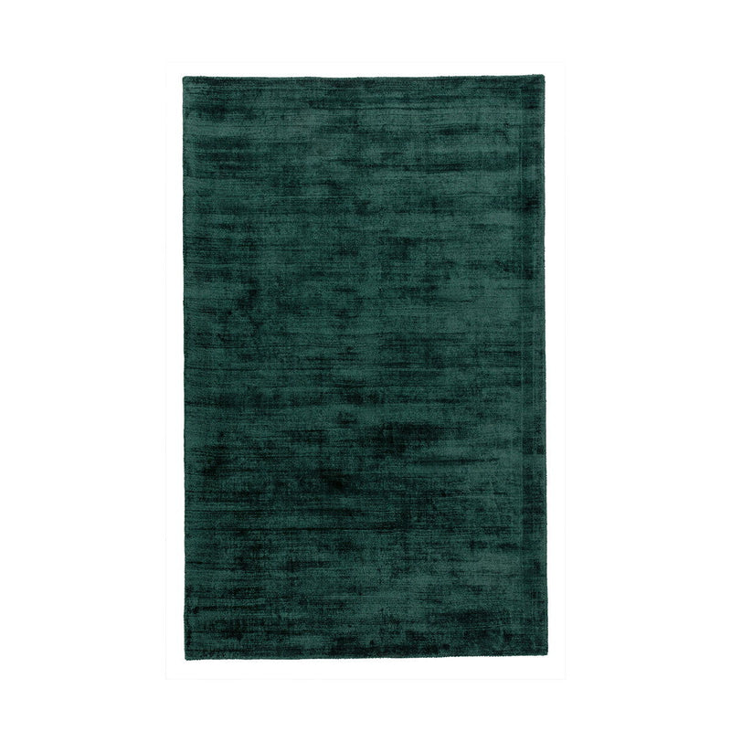 Berlin rug in deep teal green with distressed texture and flat woven surface