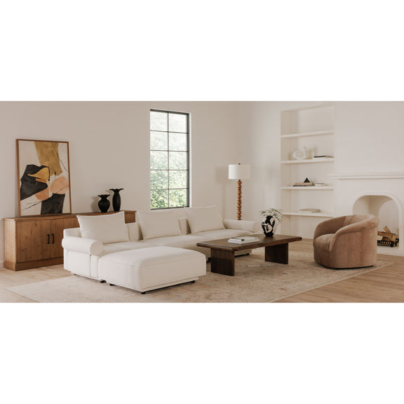 Brown wooden coffee table centered in living room with sofa and armchair