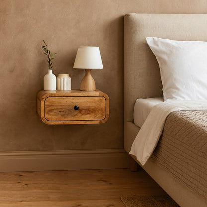 Wall-mounted wooden nightstand with one drawer and black round knob; medium-brown finish