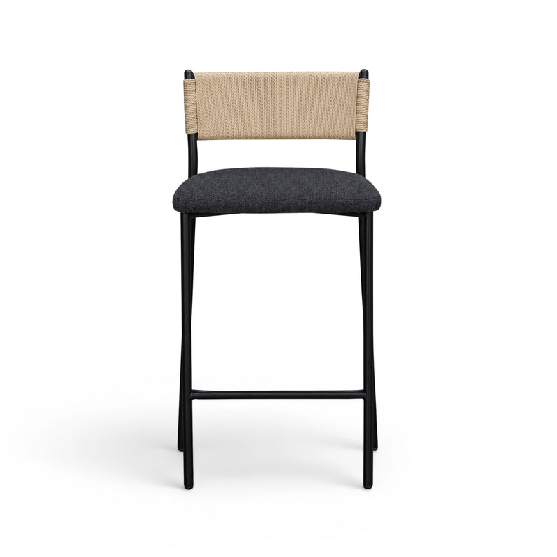 Celine boucle bar stool with beige back and dark upholstered seat, black metal legs.