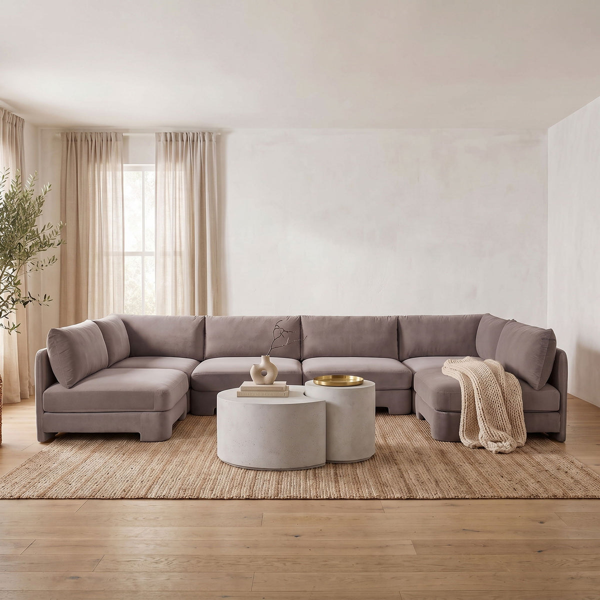 Light gray velvet armless U-shaped sectional sofa with deep padded cushions