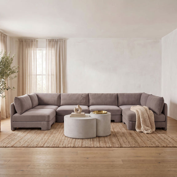 Light gray velvet armless U-shaped sectional sofa with deep padded cushions