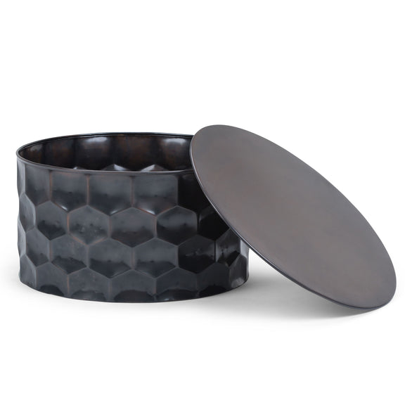 Round dark metal storage drum table with hinged lid open, faceted hex pattern