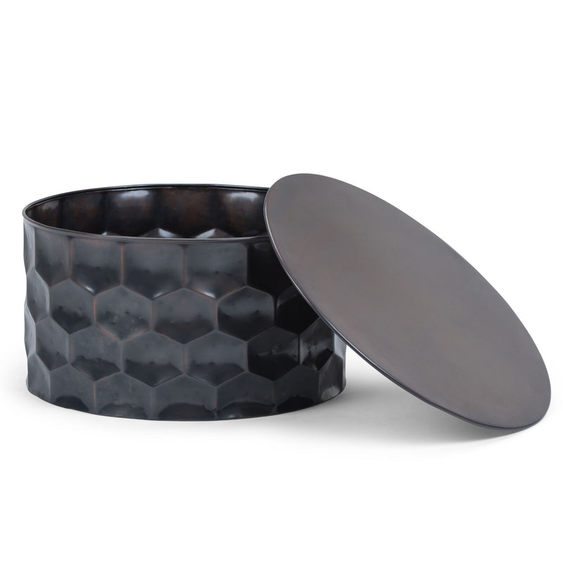 Round dark metal storage drum table with hinged lid open, faceted hex pattern