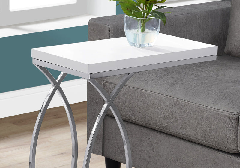 White square top C-shaped accent table with chrome metal legs and X frame.