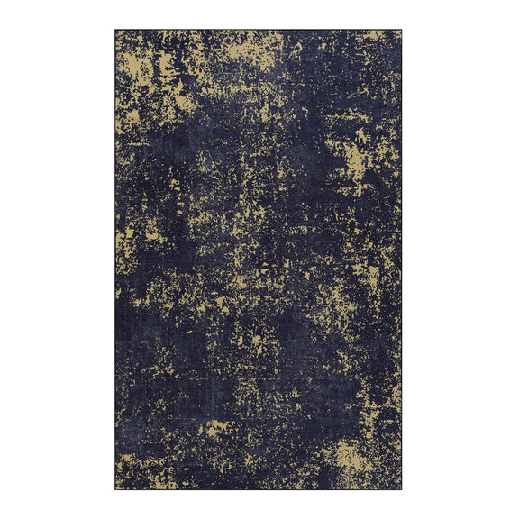 Washable area rug with dark navy and pale yellow abstract distressed pattern