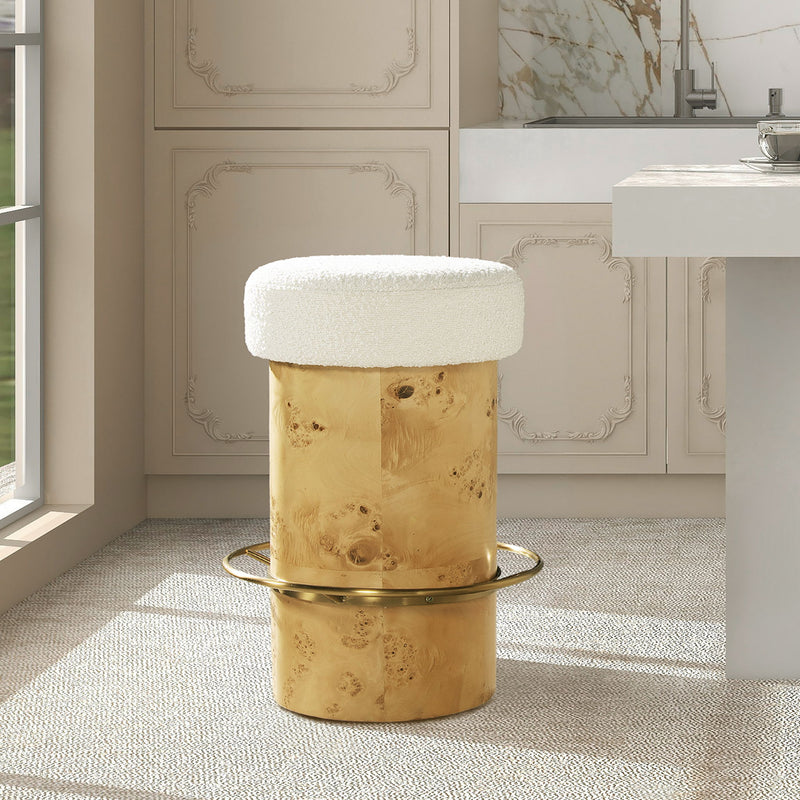 Ivory upholstered round counter stool with burl-style base and brass ring footrest