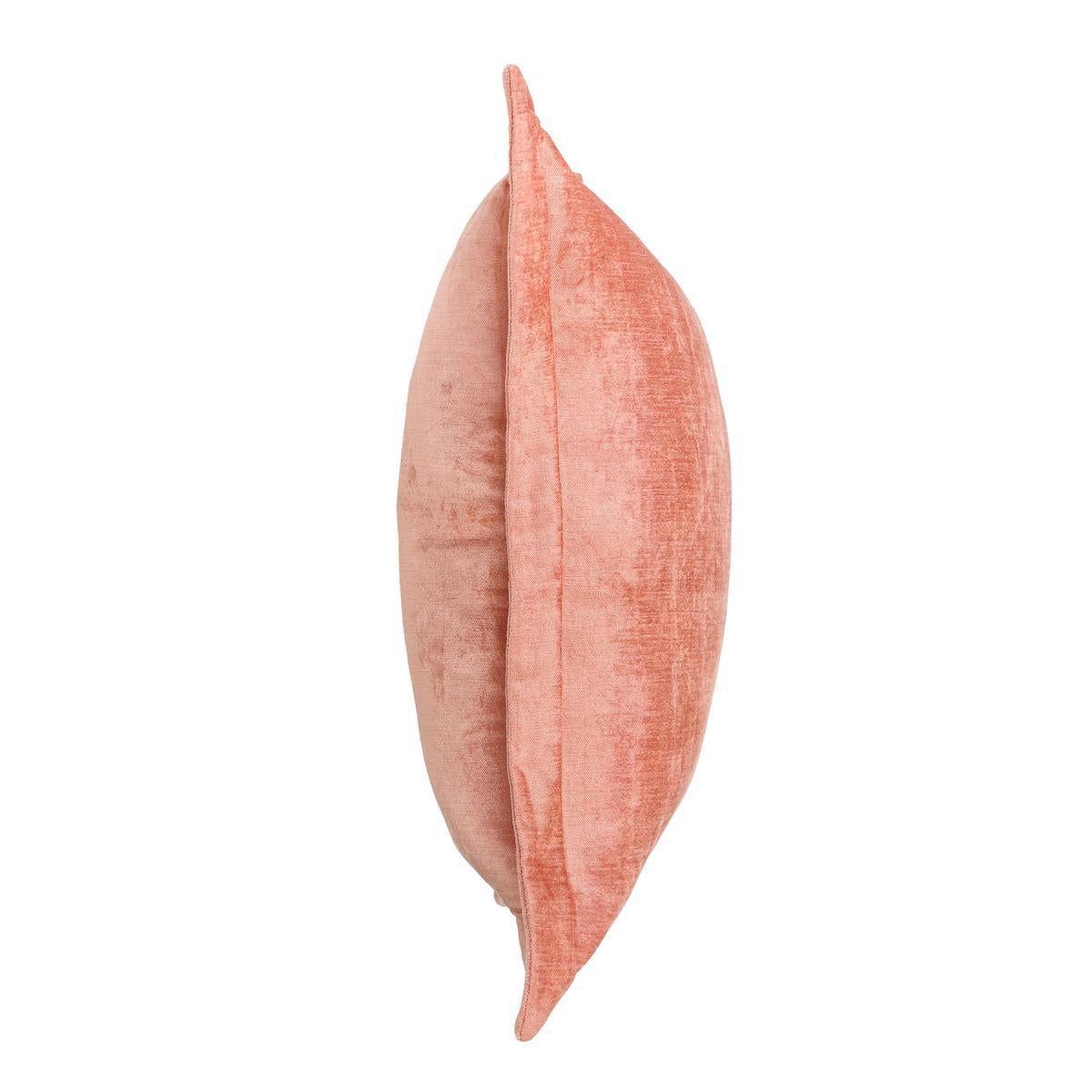 Coral pink square throw pillow side view with piped edge and textured weave