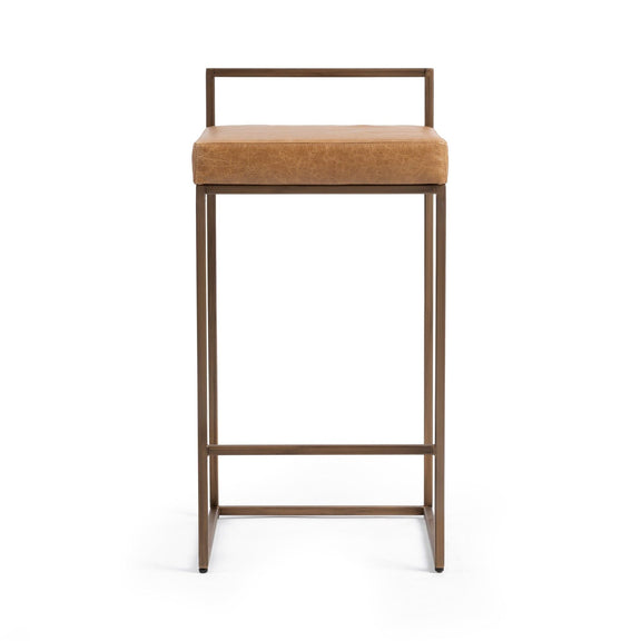 Chestnut counter stool with tan upholstered seat and light wood-tone frame, backless