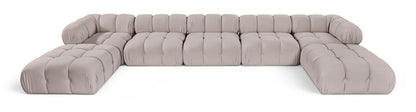 Light gray modular sectional sofa with tufted cushions and rounded armrests